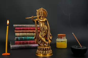 Petite statue bénie de Krishna en laiton